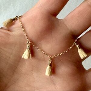Belladaar Gold bracelet with cream tassels